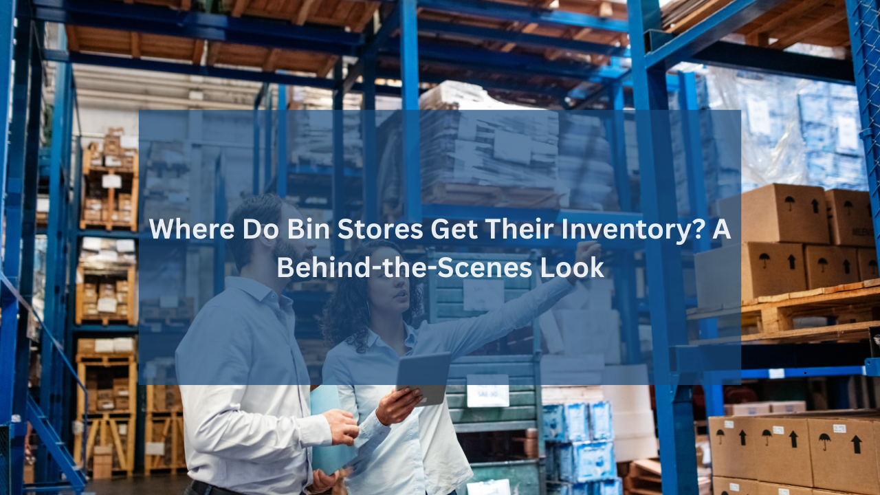 Two people inspecting inventory inside a warehouse filled with stacked boxes and pallets, representing how bin stores source their merchandise behind the scenes.